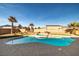 Inviting kidney shaped pool with spa and ample patio space at 1110 Geofrey St, Pahrump, NV 89060