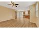 Open concept living room and kitchen with wood-look floors at 1132 Via Fellini, Henderson, NV 89052