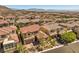 Aerial view of a house in a community with mountain views at 12048 Portamento Ct, Las Vegas, NV 89138