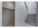 Grey staircase and storage closet in entryway at 178 May Park Ave, Henderson, NV 89011