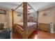 Bedroom with large wooden canopy bed and hardwood floors at 2211 Sleepy Ct, Las Vegas, NV 89106