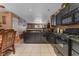 Modern kitchen with black cabinets and granite countertops at 2211 Sleepy Ct, Las Vegas, NV 89106