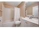 Clean bathroom with white vanity, bathtub and shower at 2721 San Lago Ct, Las Vegas, NV 89121