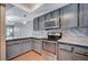 Gray cabinets and granite countertops in this kitchen at 2721 San Lago Ct, Las Vegas, NV 89121