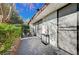 Small patio area with seating and access to the building at 2721 San Lago Ct, Las Vegas, NV 89121