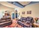 Living room with leather sofas and a view into the kitchen at 3236 Sundown Dr, Las Vegas, NV 89169