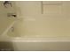 Clean bathtub with neutral wall tile at 3817 Bella Legato Ave, North Las Vegas, NV 89081