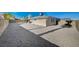 Large backyard with gravel and a covered patio at 4385 El Cebra Way, Las Vegas, NV 89121