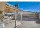 Large backyard with gravel, covered patio, and grill at 4385 El Cebra Way, Las Vegas, NV 89121