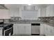 Updated kitchen featuring gray countertops and white cabinets at 4385 El Cebra Way, Las Vegas, NV 89121