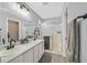 Modern bathroom with double vanity and walk-in shower at 5515 Gold Mint Ln, Las Vegas, NV 89122