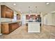 Kitchen with island, dark wood cabinets, and granite counters at 6093 Crown Palms Ave, Las Vegas, NV 89139