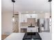 Modern kitchen with white shaker cabinets, stainless steel appliances and herringbone backsplash at 6121 Denver Cir, Las Vegas, NV 89107