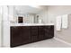 Modern bathroom with double vanity and large mirror at 7023 Bering Strait Ave, Las Vegas, NV 89179