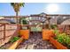 Landscaped patio with pergola, fire pit and seating area at 7023 Bering Strait Ave, Las Vegas, NV 89179