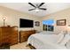 Comfortable bedroom with large dresser and window views at 7563 Saguaro Cactus Ave, Las Vegas, NV 89178