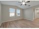 Spacious bedroom with wood-look floors and ceiling fan at 7564 Daniel Boone Ct, Las Vegas, NV 89166