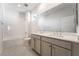 Modern bathroom with double vanity, shower, and bathtub at 765 Black Palace St, Henderson, NV 89011