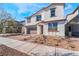 Two-story house with brown garage door and brick driveway at 765 Black Palace St, Henderson, NV 89011