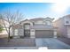 Two-story house with a brown garage door and landscaping at 917 Scarlet Haze Ave, Las Vegas, NV 89183