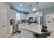 Modern kitchen with stainless steel appliances and an island at 1012 Via Lombardi Ave, Henderson, NV 89011