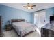 Primary bedroom with a king-size bed and ceiling fan at 1017 Amber Gate St, Henderson, NV 89002