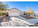 Single-story house with attached garage and landscaped front yard at 1017 Amber Gate St, Henderson, NV 89002