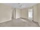 Bedroom with gray carpet, ceiling fan, and closet at 10646 Shifting Breeze Ave, Las Vegas, NV 89129