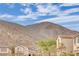 Community view showcasing mountain backdrop and homes at 10646 Shifting Breeze Ave, Las Vegas, NV 89129