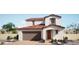 Two-story home with Spanish-style architecture, two-car garage, and landscaping at 180 May Park Ave, Henderson, NV 89011