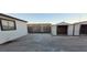 Backyard view with sheds, concrete patio, and a block wall at 2740 Vita Dr, North Las Vegas, NV 89030