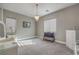 Bright bedroom with a dresser and seating area at 3428 Isle Dr, Las Vegas, NV 89141