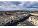 Aerial view of townhouses and mountain views in the distance at 3585 Arcadian Sea St, Las Vegas, NV 89106