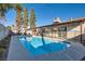 Sparkling blue pool with concrete decking and fence at 3665 Bronco Rd, Las Vegas, NV 89103