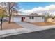 Charming single story home with a newly paved driveway and well manicured landscaping at 5512 Burntwood Way, Las Vegas, NV 89108