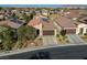 Single-story home with solar panels and two-car garage, nice curb appeal at 5658 Pleasant Palms St, North Las Vegas, NV 89081