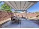 Covered patio with pergola and outdoor dining area at 5658 Pleasant Palms St, North Las Vegas, NV 89081