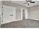 Bedroom with carpet, ceiling fan, and walk-in closet at 6024 Tokara Ave, Las Vegas, NV 89122