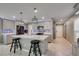 Spacious kitchen featuring an island, stainless steel appliances, and gray cabinets at 6530 Secret Grove Ave, Las Vegas, NV 89130