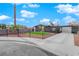 Modern house with yellow door and grassy yard at 709 Osprey Cir, Las Vegas, NV 89107