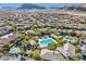 Aerial view of community showing homes, pools, and landscape at 9281 Ram Creek Ln, Las Vegas, NV 89178