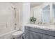 Bathroom with gray vanity and shower/tub combo at 9347 Malaya Garnet Ct, Las Vegas, NV 89148