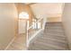 Bright entryway with tiled floor and staircase at 955 Leadville Meadows Dr, Henderson, NV 89052