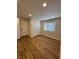 Spacious bedroom with wood-look floors and double door closet at , Las Vegas, NV 89147