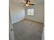 Bright bedroom with ceiling fan and double doors at 1065 Elation Ln # 102, Henderson, NV 89002