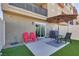 Private backyard oasis with patio furniture and artificial grass at 12213 Harvest Sky Way # 6, Las Vegas, NV 89183