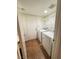 Laundry room with washer, dryer, and shelving at 1605 Calle Montery St, Las Vegas, NV 89117