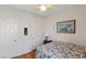 Bedroom with double doors and wood floors at 1704 Nestled Meadows Ln, Las Vegas, NV 89128