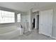 Modern bathroom with walk-in shower and large tub at 2293 Teatro Ave, Henderson, NV 89044