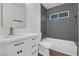 Modern bathroom featuring gray tile and updated vanity at 2923 Palora Ave, Las Vegas, NV 89121